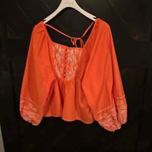 Rain: crop top colored orange and white top